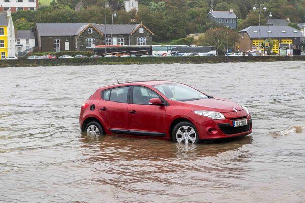  A car parked on Bantry quays was swamped by the rising tide. Picture: Andy Gibson.