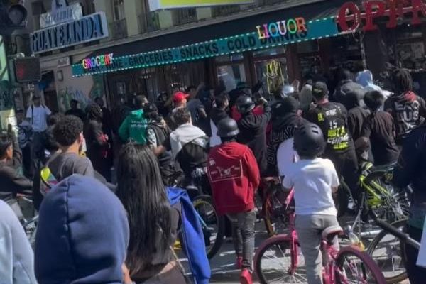 The unidentified employee was standing outside Golden Hours Liquor on International Boulevard in Oakland on Saturday where he confronted the bicyclists who had surrounded the area outside of the store.